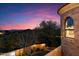 Home exterior showcasing stone and landscaping at sunset at 28626 N 108Th N Way, Scottsdale, AZ 85262