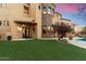 Elegant home exterior with lush landscaping and a view of the pool at 28626 N 108Th N Way, Scottsdale, AZ 85262