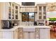 Kitchen features a farmhouse sink and custom cabinetry at 28626 N 108Th N Way, Scottsdale, AZ 85262