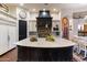 Spacious kitchen with marble island and black cabinets at 28626 N 108Th N Way, Scottsdale, AZ 85262