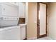 Laundry room with stackable washer and dryer at 28626 N 108Th N Way, Scottsdale, AZ 85262