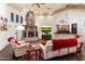 Spacious living room with stone fireplace, wet bar, and hardwood floors at 28626 N 108Th N Way, Scottsdale, AZ 85262