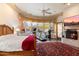 Luxurious main bedroom with fireplace, home gym, and large windows at 28626 N 108Th N Way, Scottsdale, AZ 85262