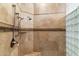 Large walk-in shower with glass block wall and tiled bench at 28626 N 108Th N Way, Scottsdale, AZ 85262