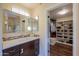 Bathroom with vanity and walk-in closet at 3816 E Minton Pl, Mesa, AZ 85215