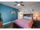 Bedroom with queen bed, wood dresser, and ceiling fan at 3816 E Minton Pl, Mesa, AZ 85215