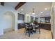 Eat-in kitchen with dark wood cabinets and granite counters at 3816 E Minton Pl, Mesa, AZ 85215