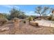 Desert landscape with gravel, plants, and a stamped concrete patio at 40849 N Union Trl, Anthem, AZ 85086