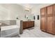 Clean bathroom with a single vanity and bathtub at 4164 S Roger Way, Chandler, AZ 85249