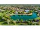 Aerial view of community with lake and clubhouse at 4205 E Bonanza Rd, Gilbert, AZ 85297