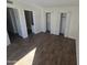 Bedroom with double closets and dark wood floors at 4409 E Darrel Rd, Phoenix, AZ 85042