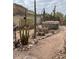 Desert landscaping with hot tub in the backyard at 4943 S Las Mananitas Trl, Gold Canyon, AZ 85118