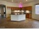 Open kitchen featuring a spacious island, granite countertops, and stainless steel appliances at 4943 S Las Mananitas Trl, Gold Canyon, AZ 85118