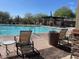 Enjoy the community pool with lounge chairs and shade structures for outdoor relaxation at 4943 S Las Mananitas Trl, Gold Canyon, AZ 85118
