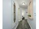 Bright hallway with wood-look floors and an ornate mirror at 5450 E Deer Valley Dr # 2023, Phoenix, AZ 85054