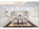 Formal dining room with a chandelier and white chairs at 5916 E Sandra Ter, Scottsdale, AZ 85254