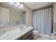 Bathroom with single vanity, marble countertop, and bathtub at 5998 N 78Th St # 116, Scottsdale, AZ 85250