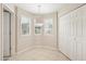 Cozy dining nook with tile flooring, a pendant light, two windows with blinds, and a closet at 5998 N 78Th St # 116, Scottsdale, AZ 85250