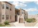 Two-story condo building with stucco exterior, landscaped grounds, and stairway to the units at 5998 N 78Th St # 116, Scottsdale, AZ 85250