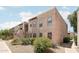 Condo building featuring two-story stucco exterior with desert landscaping and gravel ground cover at 5998 N 78Th St # 116, Scottsdale, AZ 85250