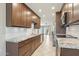 Well-lit kitchen features stainless steel appliances, granite countertops and ample cabinet space with tile floors at 5998 N 78Th St # 116, Scottsdale, AZ 85250