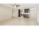 Open concept living area featuring tile flooring, view into the kitchen with dark wood cabinetry at 5998 N 78Th St # 116, Scottsdale, AZ 85250