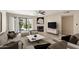 Inviting living room with a fireplace, contemporary decor, comfortable seating, and sliding doors with natural light at 5998 N 78Th St # 116, Scottsdale, AZ 85250