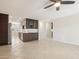 Open living space with a full kitchen, a ceiling fan, and tile floors offering a versatile layout at 5998 N 78Th St # 116, Scottsdale, AZ 85250