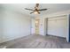 Spacious bedroom with neutral walls, ceiling fan, and ample closet space at 7519 N 23Rd Ave, Phoenix, AZ 85021