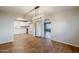 Dining area with wood floors and kitchen access at 7519 N 23Rd Ave, Phoenix, AZ 85021