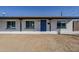 House exterior with blue front door and a neat front yard at 7519 N 23Rd Ave, Phoenix, AZ 85021