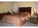 Bedroom with double bed, wood furniture, and carpet at 7807 E Main St # Cc-70, Mesa, AZ 85207