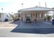 Mobile home with carport and seating area at 7807 E Main St # Cc-70, Mesa, AZ 85207