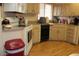 Galley kitchen with white appliances and wood-look flooring at 7807 E Main St # Cc-70, Mesa, AZ 85207