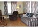 Living room with recliner, sofa, and wood-look flooring at 7807 E Main St # Cc-70, Mesa, AZ 85207