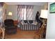 Living room with recliner, sofa, and wood-look flooring at 7807 E Main St # Cc-70, Mesa, AZ 85207
