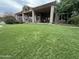 Landscaped backyard with artificial turf and view of home at 8300 S Homestead Ln, Tempe, AZ 85284