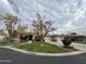 House exterior with a landscaped yard and driveway at 8300 S Homestead Ln, Tempe, AZ 85284