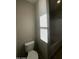 Clean bathroom with toilet and a window at 14727 W Pasadena Ave, Litchfield Park, AZ 85340
