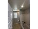 Bathroom with tub, shower, and window at 14727 W Pasadena Ave, Litchfield Park, AZ 85340