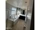 Luxurious bathroom features a soaking tub, separate shower, and modern fixtures at 14727 W Pasadena Ave, Litchfield Park, AZ 85340