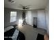 Bright bedroom with carpeted floors and large windows at 14727 W Pasadena Ave, Litchfield Park, AZ 85340