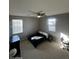 Spacious bedroom with carpeted floors and large windows at 14727 W Pasadena Ave, Litchfield Park, AZ 85340