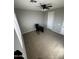 Bright bedroom with carpeted floor and ceiling fan at 14727 W Pasadena Ave, Litchfield Park, AZ 85340