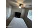 Comfortable bedroom with a queen bed and ensuite access at 14727 W Pasadena Ave, Litchfield Park, AZ 85340