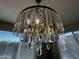 Close-up view of a crystal chandelier at 14727 W Pasadena Ave, Litchfield Park, AZ 85340