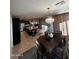 Open concept dining room with kitchen view at 14727 W Pasadena Ave, Litchfield Park, AZ 85340