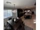 Bright dining room with chandelier and seating for six at 14727 W Pasadena Ave, Litchfield Park, AZ 85340