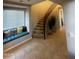 Spacious entry with a curved staircase, window seat, and tile floors at 14727 W Pasadena Ave, Litchfield Park, AZ 85340