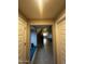Elegant entryway with curved staircase, tile flooring, and built-in seating at 14727 W Pasadena Ave, Litchfield Park, AZ 85340